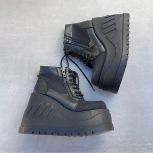 Demonia STOMP-10 Wedge Platform Lace-Up Bootie in Black Canvas